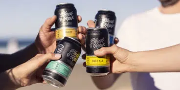 black-hops-cheers-cans-beach