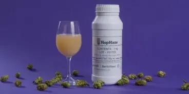 Bottle of Hop Haze next to a wine glass